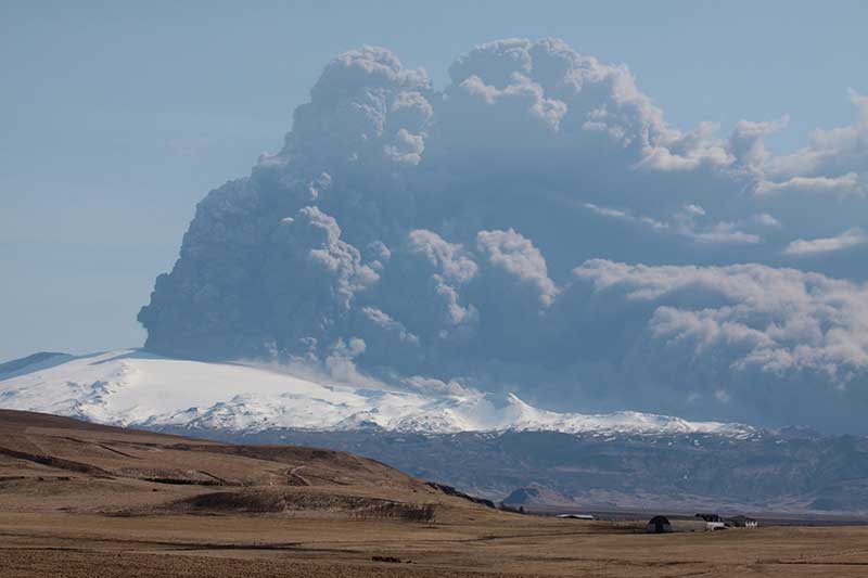 Volcano is belching out a huge cloud of ash.