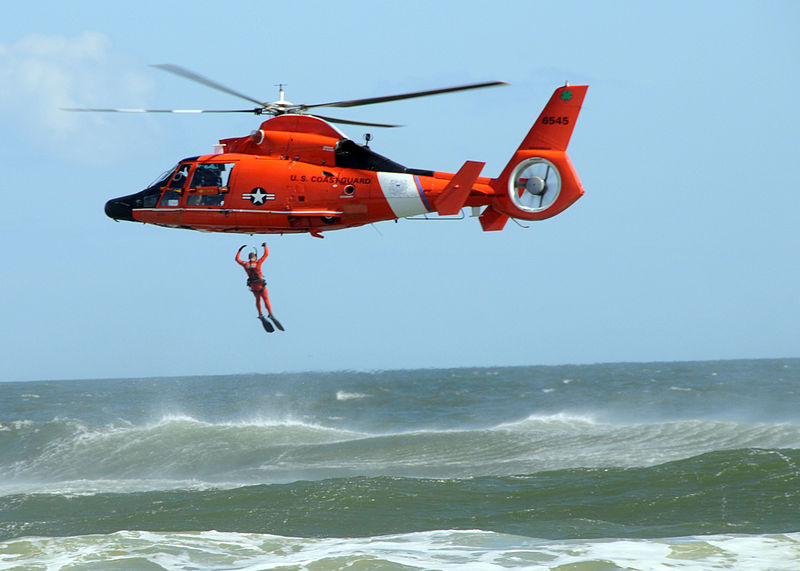 A Coast Guardsman leaps from a helicopter into the ocean. Credit: US Navy.
