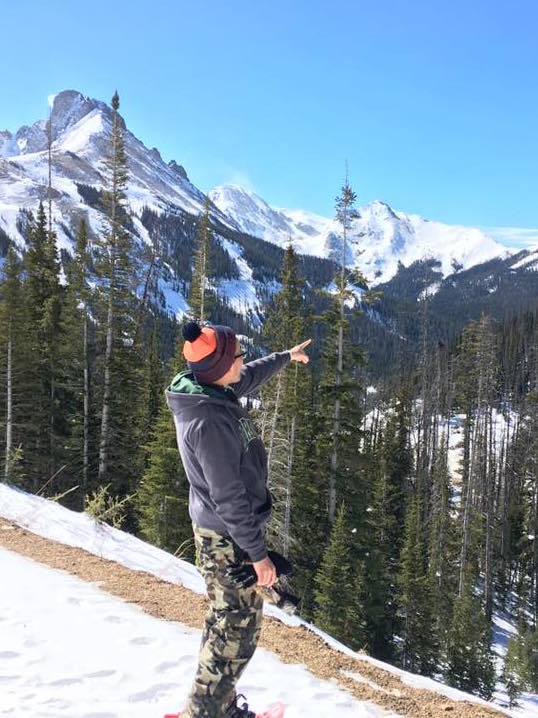 Caption: In his spare time, Torres enjoys snowshoeing in the Rocky Mountains.